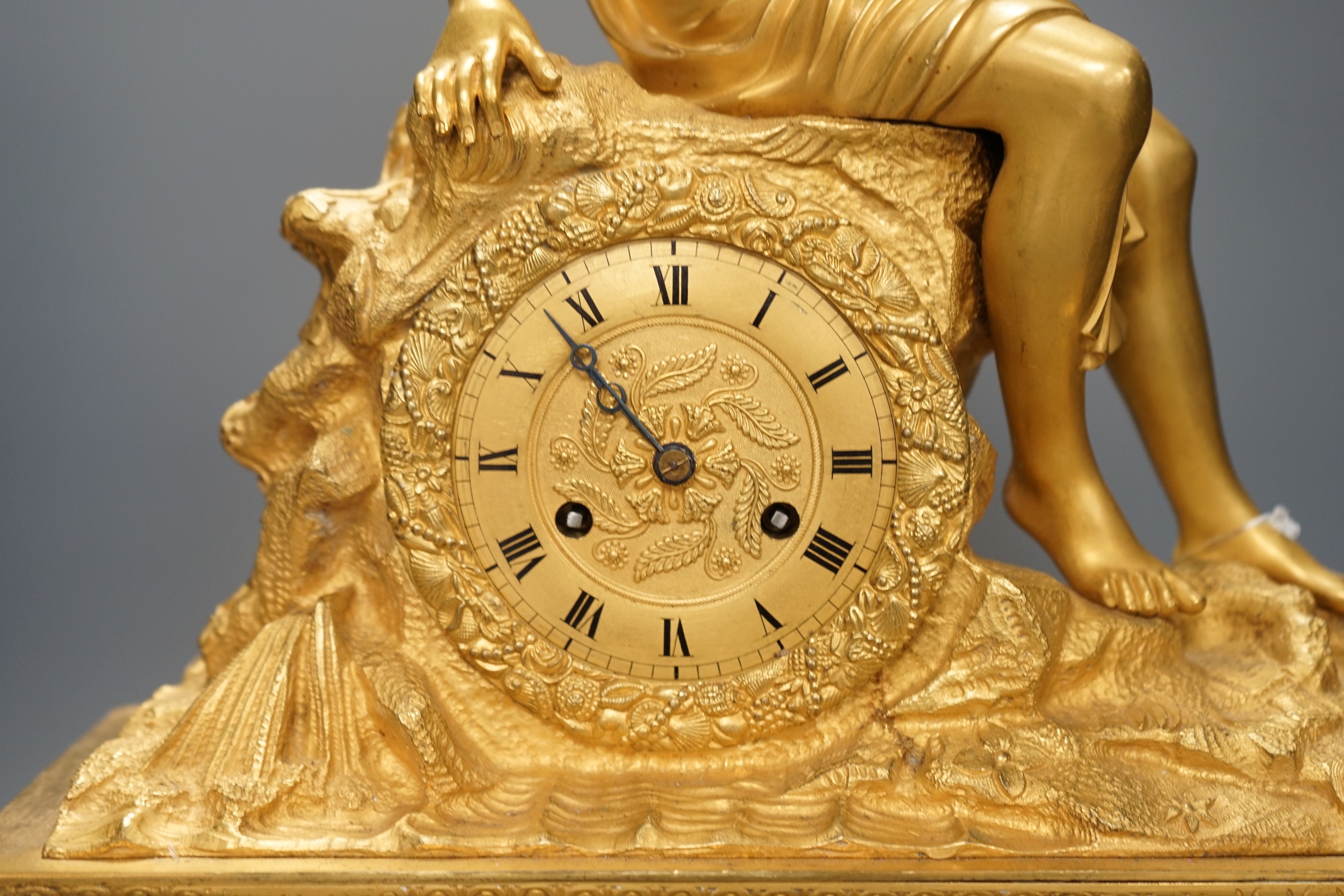 A 19th century French 'Pipe player' ormolu clock, 57cm tall